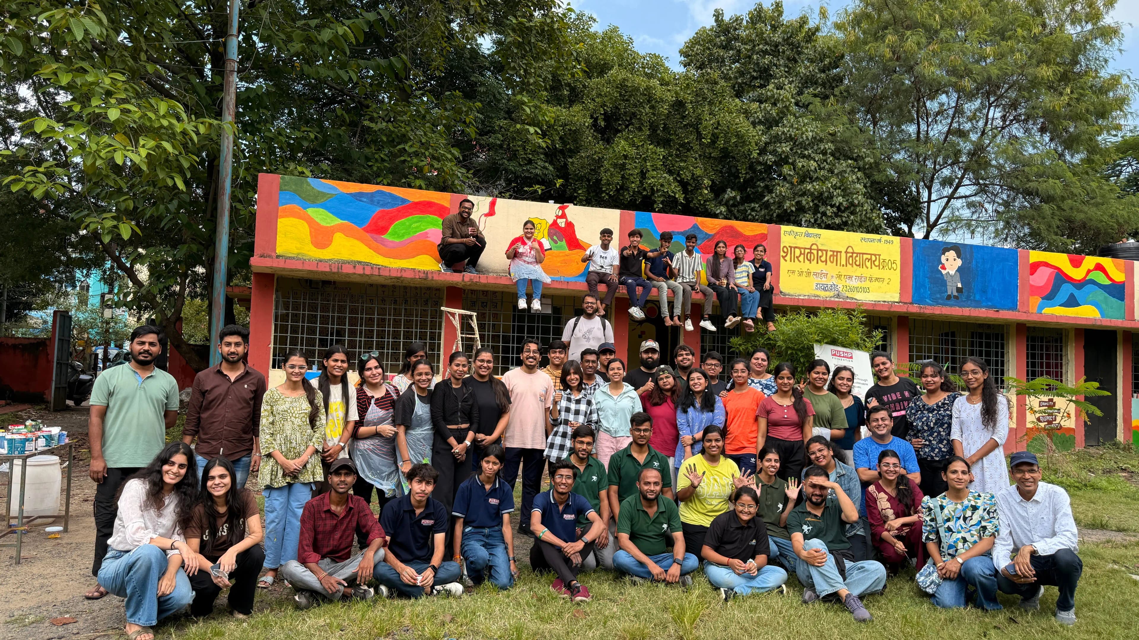 Volunteers supporting children in a community learning session